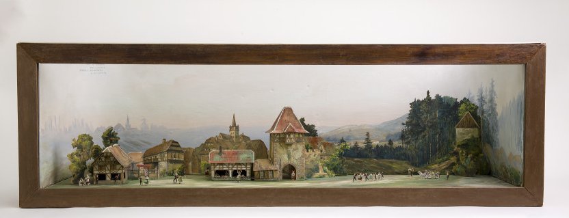 	Auguste Ramel, Maquette du village alsacien, bois peint pour la caisse, toile, carton et papier, peints et assemblés pour le décor, 1908-1909